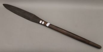 A South Seas carved wooden club. 103.5 cm long.
