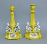 A pair of porcelain candlesticks. 31 cm high.