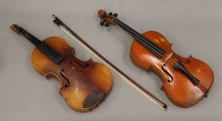 An early 20th century violin and bow, and another,