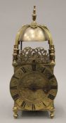 An antique lantern clock. 38.5 cm high.