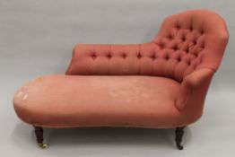 A Victorian pink button upholstered chaise lounge. Approximately 150 cm long.