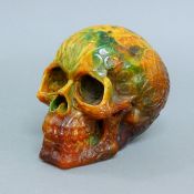 A model of a skull. 11.5 cm high.