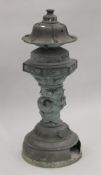 A large Oriental patinated bronze incense burner. 96 cm high.