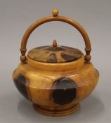 A yew wood lidded box. 20 cm diameter.