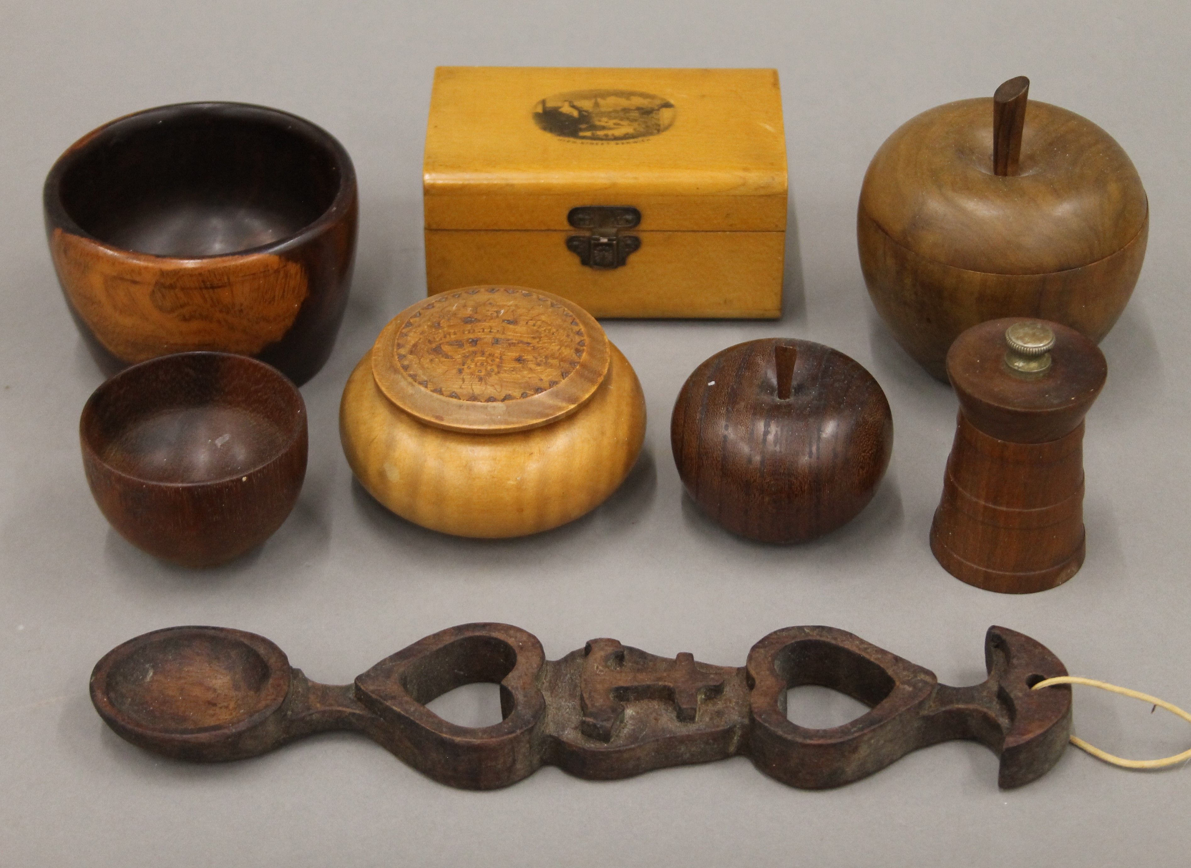 A collection of treen, including a lignum vitae wooden bowl, etc.