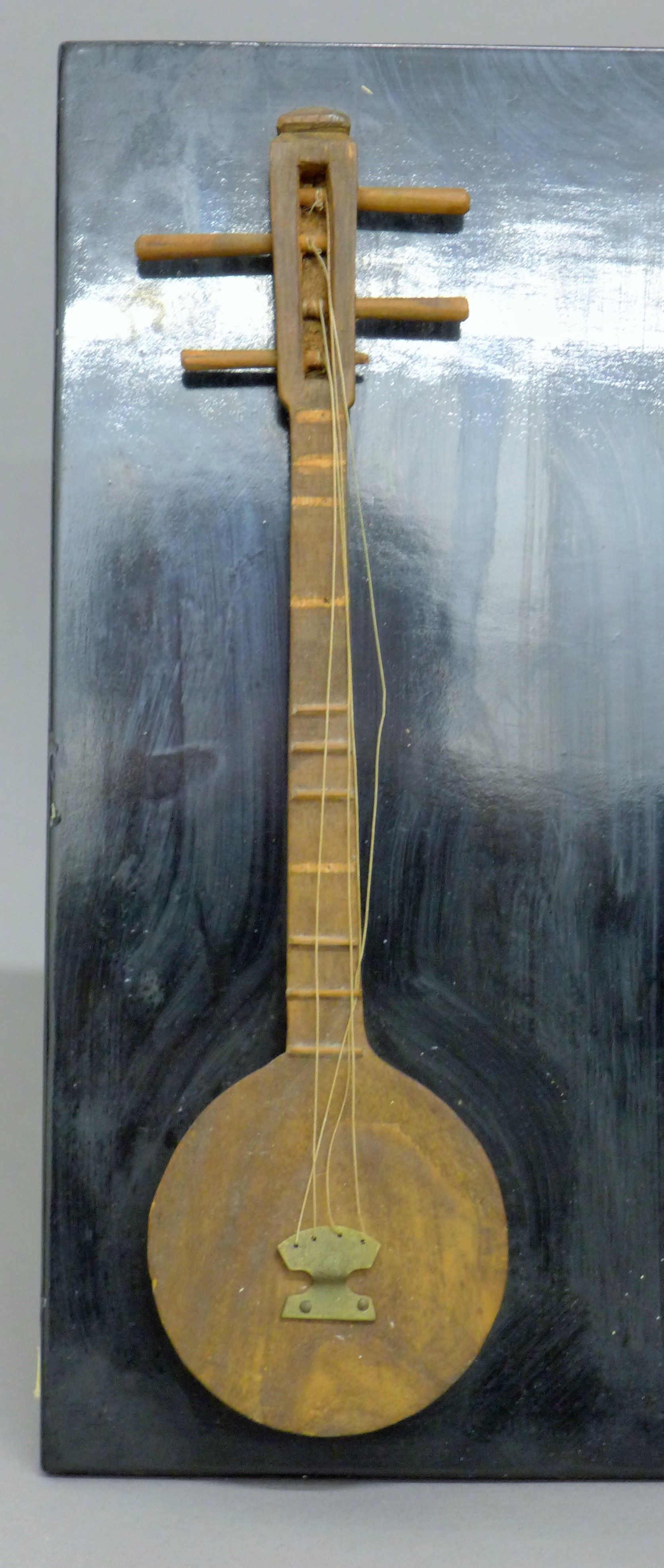 An Eastern instruments picture. 46 cm wide. - Image 2 of 5