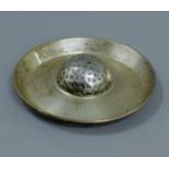 A silver golf trophy dish. 10 cm diameter. 87.3 grammes.
