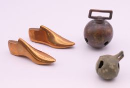 A miniature pair of bronze shoe lasts and two bells. The former 6.5 cm long.