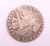 A 17th century silver coin.