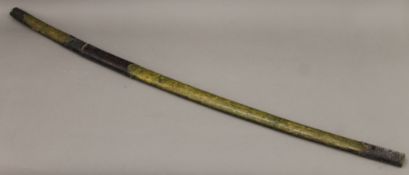 An Oriental sword in scabbard. 122.5 cm long.