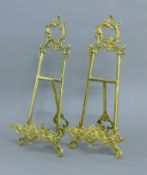A pair of brass table easels. 49 cm high.