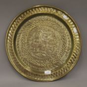 An antique brass Alms dish. 45 cm diameter.