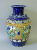 A large Chinese blue ground terracotta vase. 62 cm high.