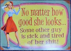 A tin sign inscribed 'No Matter How Good She Looks, Some Other Guy is Sick and Tired of Her Shit'.