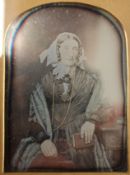 A Victorian leather cased photograph of an elderly lady. The case 9.5 x 12 cm.