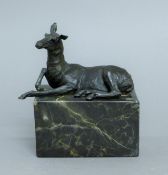 A bronze model of a deer. 16 cm high.