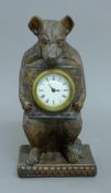 A carved bear clock. 30 cm high.