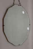 An early mid-20th century bevelled mirror. 40 cm diameter.
