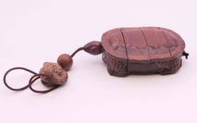A tortoise form inro. 9.5 cm long.