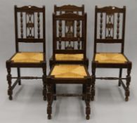 A set of four rush seated chairs. 42.5 cm wide.