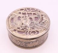 A Continental unmarked silver and rose quartz box. 7 cm diameter.