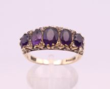 A 9 ct gold amethyst and diamond ring. Ring size O. 4.9 grammes total weight.