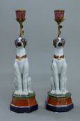 A pair of porcelain dog form candlesticks. 33 cm high.