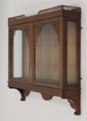 An Edwardian mahogany glazed hanging cabinet. 89.5 cm wide 88.5 cm high.