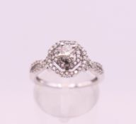 A 14 K white gold diamond ring. Ring size L/M. 3.6 grammes total weight.