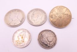 Five various silver coins.