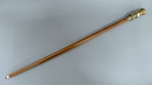 A walking stick with a telescope/compass handle. 99 cm long.