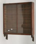 A Victorian mahogany glazed wall cabinet. 61 cm wide.
