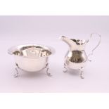 A silver cream jug and a silver sugar bowl. The latter 9.5 cm diameter. 122.7 grammes.