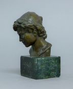 A bronze bust of a boy. 13 cm high.