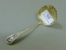 A silver sugar sifter spoon, Sheffield 1907, James Dixon and Sons. 12 cm high. 34.3 grammes.