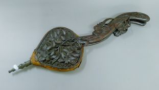 A pair of Eastern carved wooden bellows. 79 cm long.