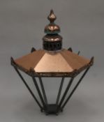 A hexagonal copper lantern. Approximately 85 cm high.