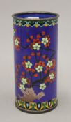 A Chinese blue cloisonne brush pot decorated with prunus blossoms. 18 cm high.