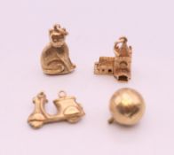 Four 9 ct gold charms. 5.7 grammes total weight.