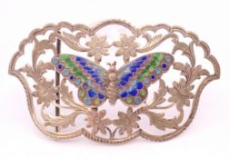 An Art Nouveau silver and enamel belt buckle with butterfly motif. 9 x 5 cm.