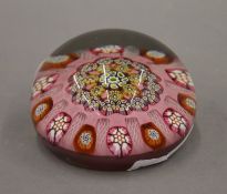 A Monart glass paperweight. 7.5 cm diameter.