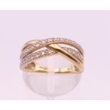 A 9 ct gold diamond ring. Ring size M. 3.2 grammes total weight.