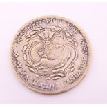 A Chinese Yun-Nan coin. 4 cm diameter.