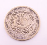 A Chinese Yun-Nan coin. 4 cm diameter.
