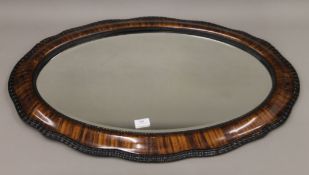 An early 20th century bevelled mirror. 82 cm high, 55.5 cm wide.