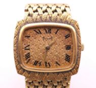 An 18 ct gold Piaget ladies wristwatch. 2.5 cm wide. 61.5 grammes total weight.