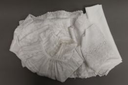 A quantity of vintage Christening gowns.