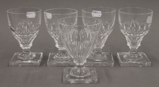 A set of four 19th century glass rummers and a single 19th century glass rummer.