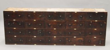 A Victorian bank of mahogany drawers. 190 cm long, 66 cm high, 34 cm deep.