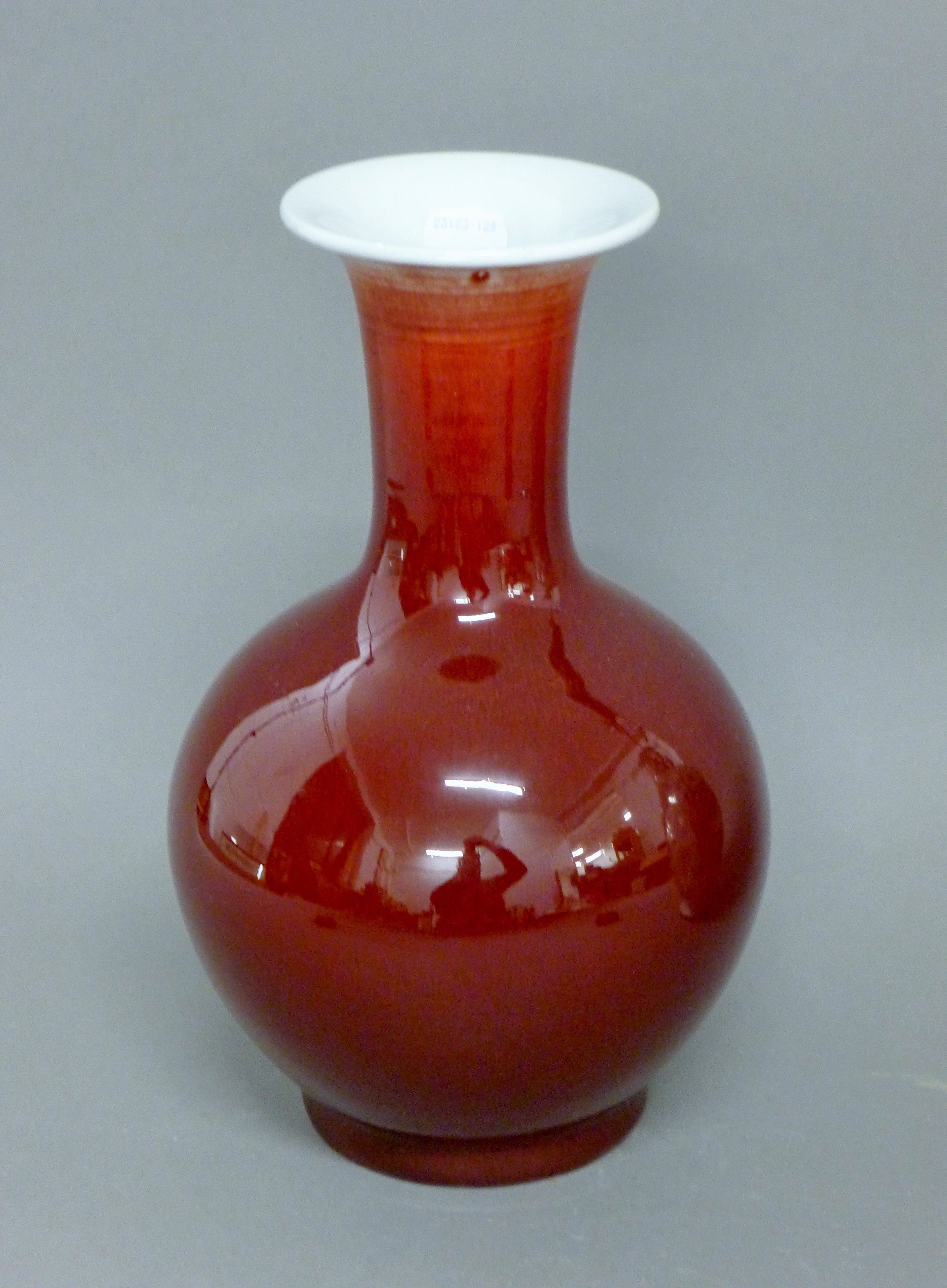A Chinese sang de boeuf porcelain vase. 30 cm high.